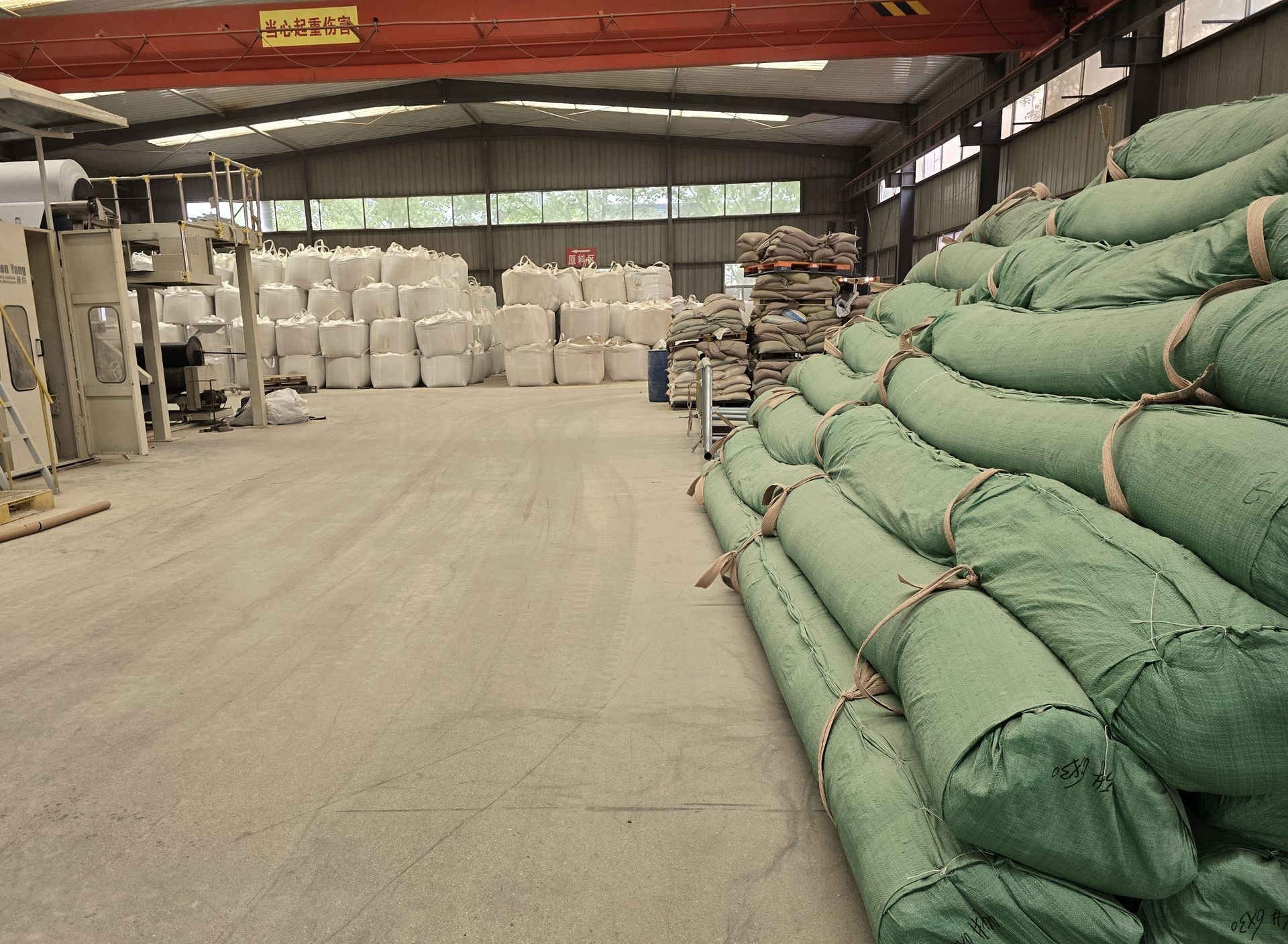 Nonwoven geotextile roll installation on a road subgrade